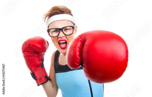 Photo: Boxer - fitness woman boxing wearing boxing gloves Boxer - fitness woman boxing wearing boxing gloves