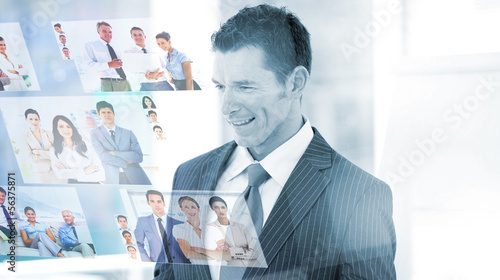 Photo: Pleased businessman looking at pictures Pleased businessman looking at pictures