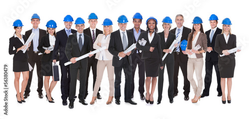 Photo: Group Of Architects With Blue Print Group Of Architects With Blue Print
