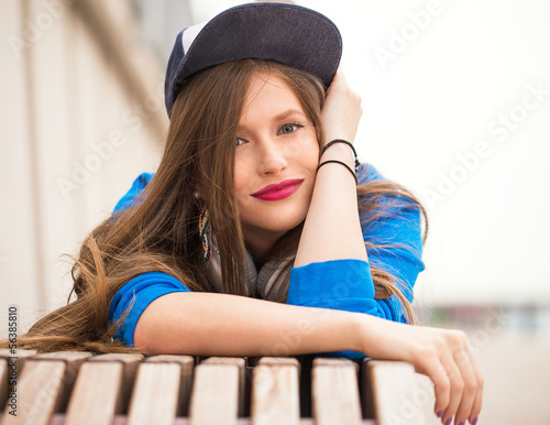 Photo: Stylish girl with a tattoo posing near river Stylish girl with a tattoo posing near river