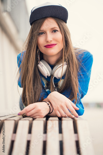 Photo: Stylish girl lying on a branch Stylish girl lying on a branch