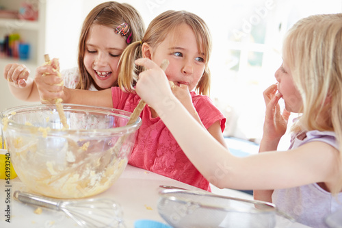 Photo: Three Girls Making Cupcakes In Kitchen Three Girls Making Cupcakes In Kitchen