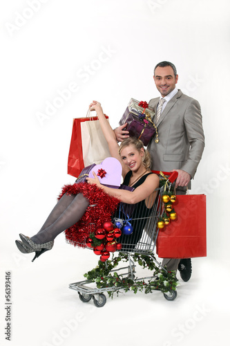 Photo: Couple with Christmas gifts Couple with Christmas gifts
