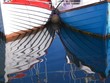 reflection of boats in water reflection of boats in water
