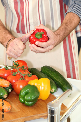 Photo: Man preparing red pepper Man preparing red pepper