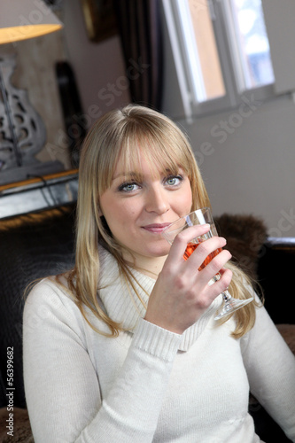 Photo: Young woman with a glass of wine Young woman with a glass of wine