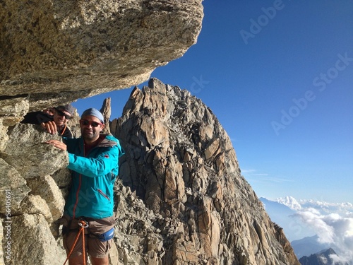 Instant Collection: Alpinist reaching summit Alpinist reaching summit