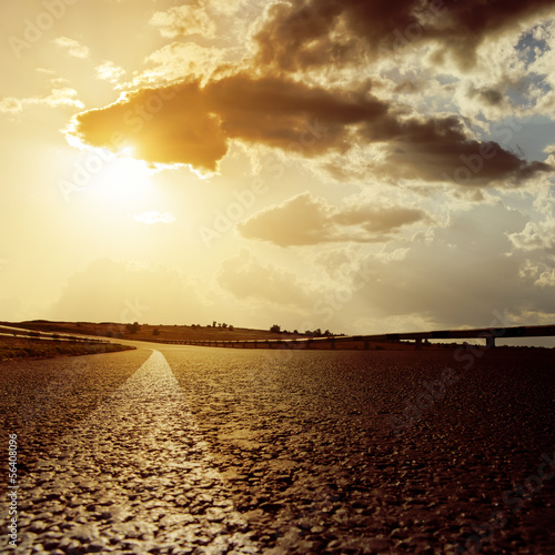 Photo: dramatic sunset and asphalt road dramatic sunset and asphalt road
