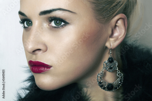 Photo: beautiful blond woman.Jewelry and Beauty.red lips.close-up beautiful blond woman.Jewelry and Beauty.red lips.close-up
