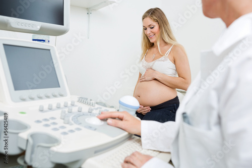 Photo: Pregnant Woman With Obstetrician In Clinic Pregnant Woman With Obstetrician In Clinic
