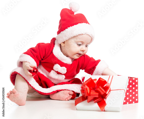 Photo: Santa Claus baby girl opening gift box isolated on white backgro Santa Claus baby girl opening gift box isolated on white backgro