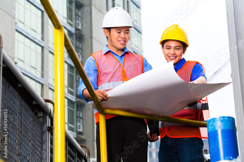 Photo: Architect and supervisor on construction site Architect and supervisor on construction site