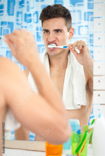 Photo: man brushing teeth man brushing teeth