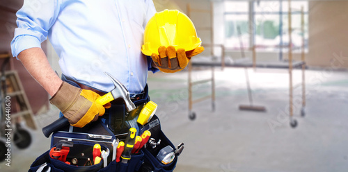 Photo: Worker with a tool belt. Worker with a tool belt.