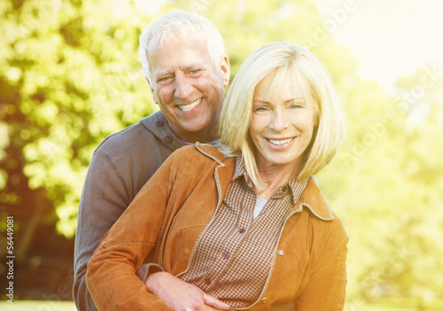 Photo: Old people over park background Old people over park background