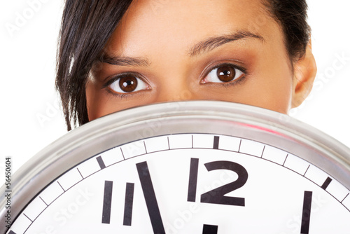 Photo: Portrait of shocked woman with clock Portrait of shocked woman with clock
