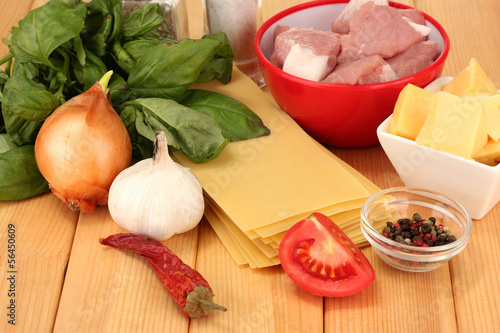 Photo: Lasagna ingredients on wooden background Lasagna ingredients on wooden background