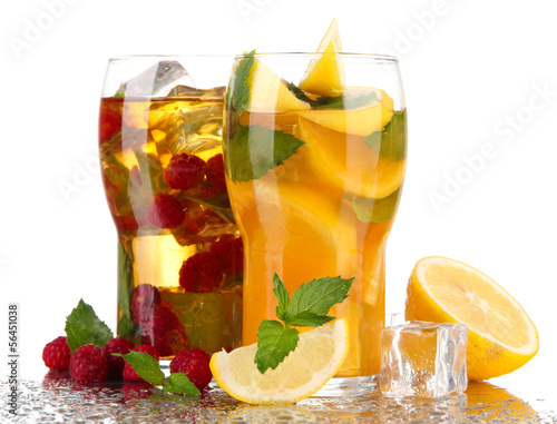 Photo: Iced tea with raspberries, lemon and mint isolated on white Iced tea with raspberries, lemon and mint isolated on white