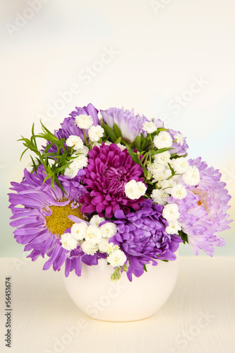 Photo: Beautiful bouquet of bright flowers in color vase, Beautiful bouquet of bright flowers in color vase,