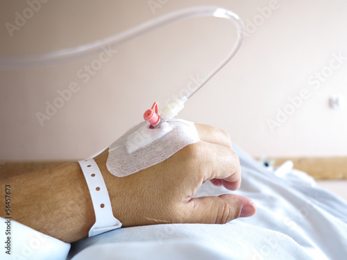 Photo: Patient's hand in the hospital with an IV Patient's hand in the hospital with an IV