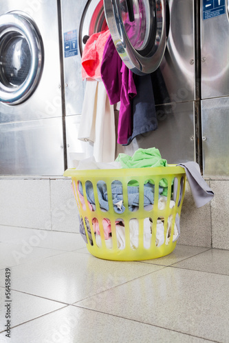 Photo: Overloaded Washing Machine And Laundry Basket Overloaded Washing Machine And Laundry Basket