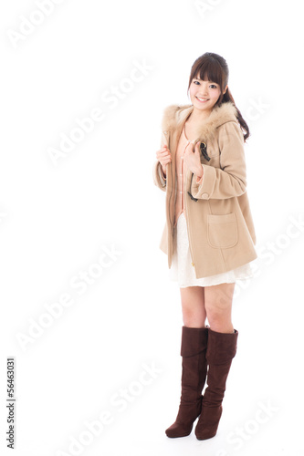 Photo: young asian woman wearing coat on white background young asian woman wearing coat on white background