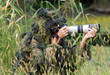 Photographer in ghillie suit in action Photographer in ghillie suit in action