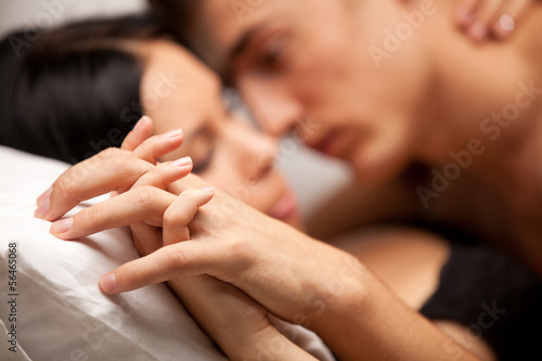 Photo: young lovers kissing on the couch young lovers kissing on the couch