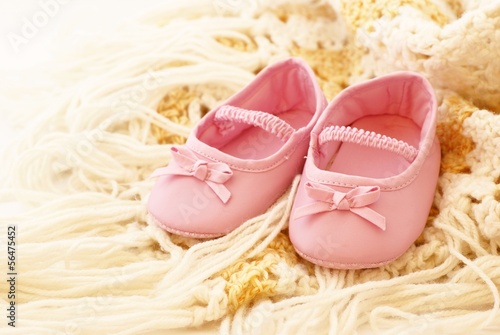 Photo: Baby pink shoes on blanket Baby pink shoes on blanket