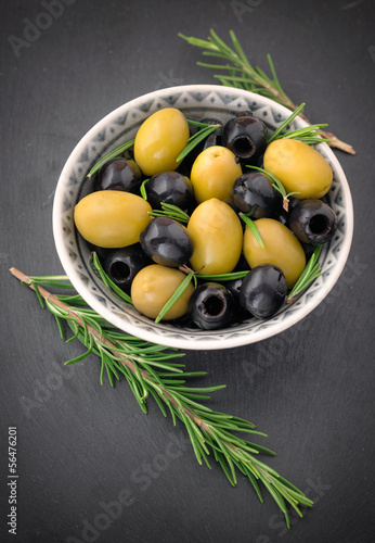 Photo: Olives with rosemary in a ceramic bowl Olives with rosemary in a ceramic bowl
