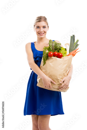 Photo: Beautiful woman carrying vegetables Beautiful woman carrying vegetables