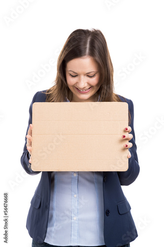 Photo: Business woman holding a cardboard Business woman holding a cardboard