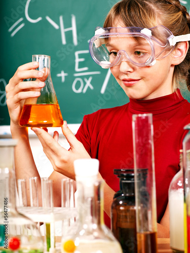 Photo: Child in chemistry class. Child in chemistry class.
