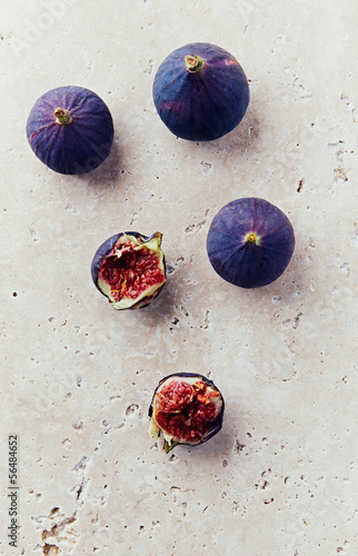 Photo: Still life with ripe figs on stone background Still life with ripe figs on stone background