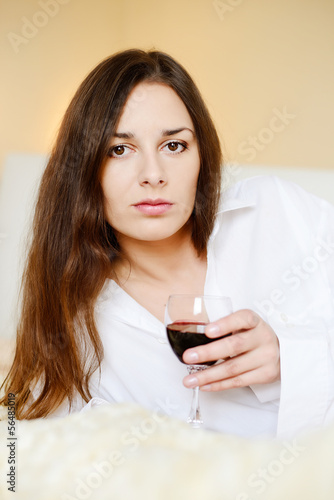 Photo: brunette with glass of wine brunette with glass of wine