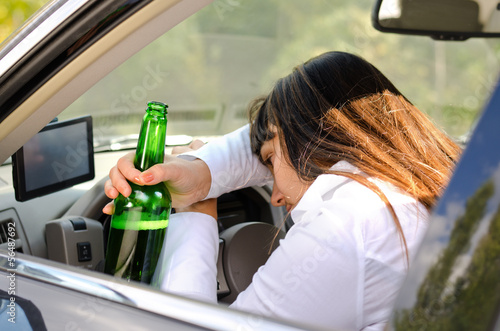 Photo: Drunk woman driver passed out in the car Drunk woman driver passed out in the car