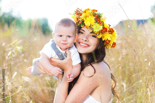 Photo: Happy mother and son in the spring meadow outdoor portrait Happy mother and son in the spring meadow outdoor portrait