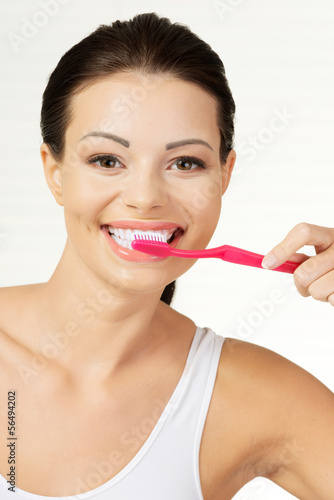 Photo: Woman holding tooth brush, isolated Woman holding tooth brush, isolated