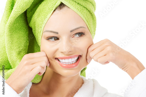Photo: Beautiful woman with a towel on her head Beautiful woman with a towel on her head