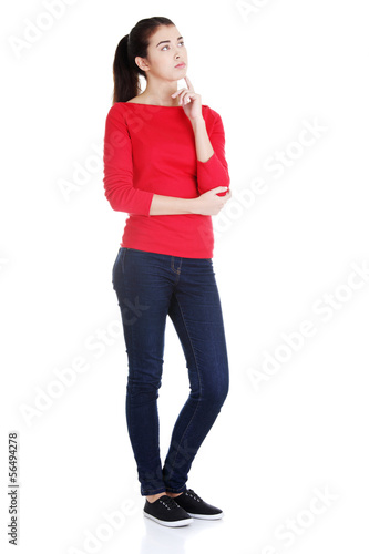 Photo: Portrait of a working woman thinking and looking up Portrait of a working woman thinking and looking up