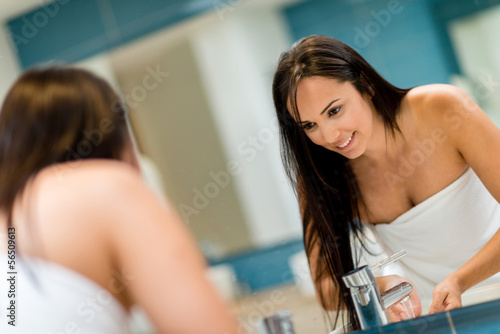 Photo: Woman cleaning her face Woman cleaning her face
