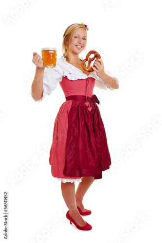 Photo: Frau im Dirndl mit Bier und Brezel Frau im Dirndl mit Bier und Brezel