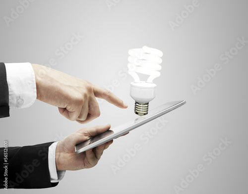 Photo: tablet and lightbulb tablet and lightbulb