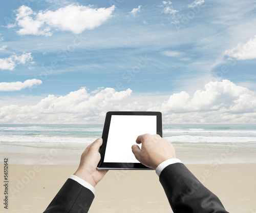 Photo: tablet on beach tablet on beach