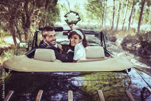 Photo: Just married couple in an old car Just married couple in an old car