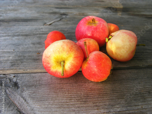Photo: Red apples on a wooden surface Red apples on a wooden surface