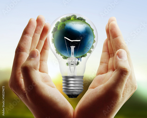 Photo: Light bulb, in hand Light bulb, in hand