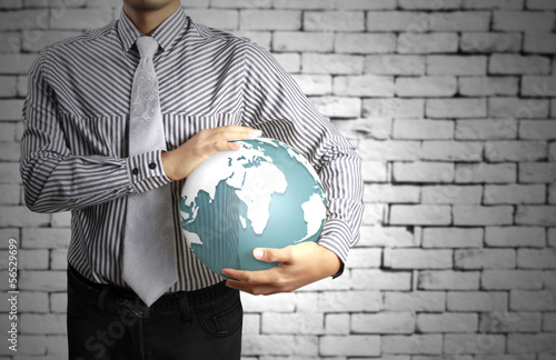 Photo: earth globe in his hands earth globe in his hands