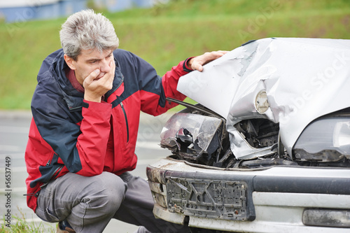 Photo: upset man after car crash upset man after car crash