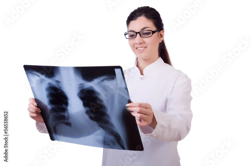 Photo: Woman doctor examining x-ray on white Woman doctor examining x-ray on white